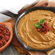 A package of Chata Refried Beans with Chorizo and a bowl containing this product appear.
