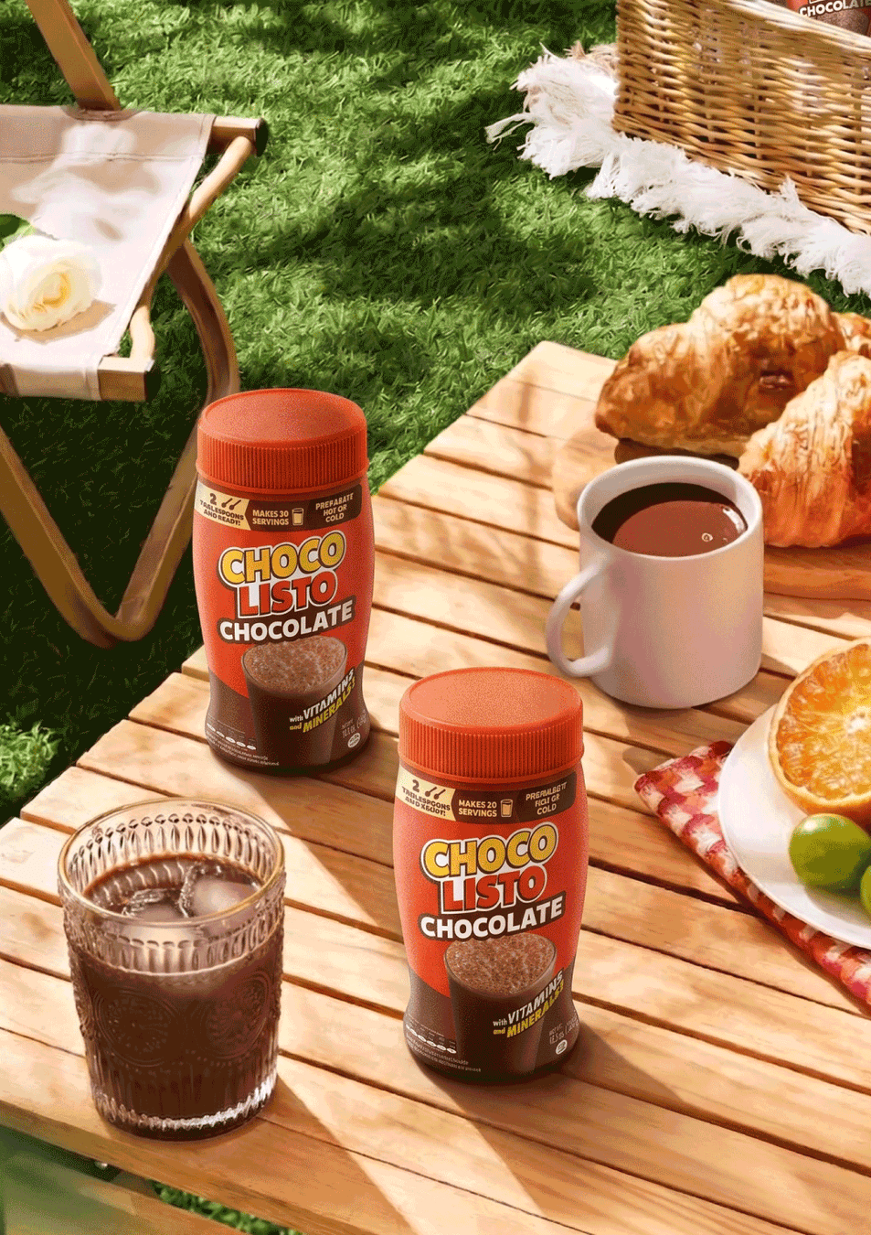 Two jars of Chocolisto, a glass of cold Chocolisto, and a small cup of hot Chocolisto, on a table representing summer