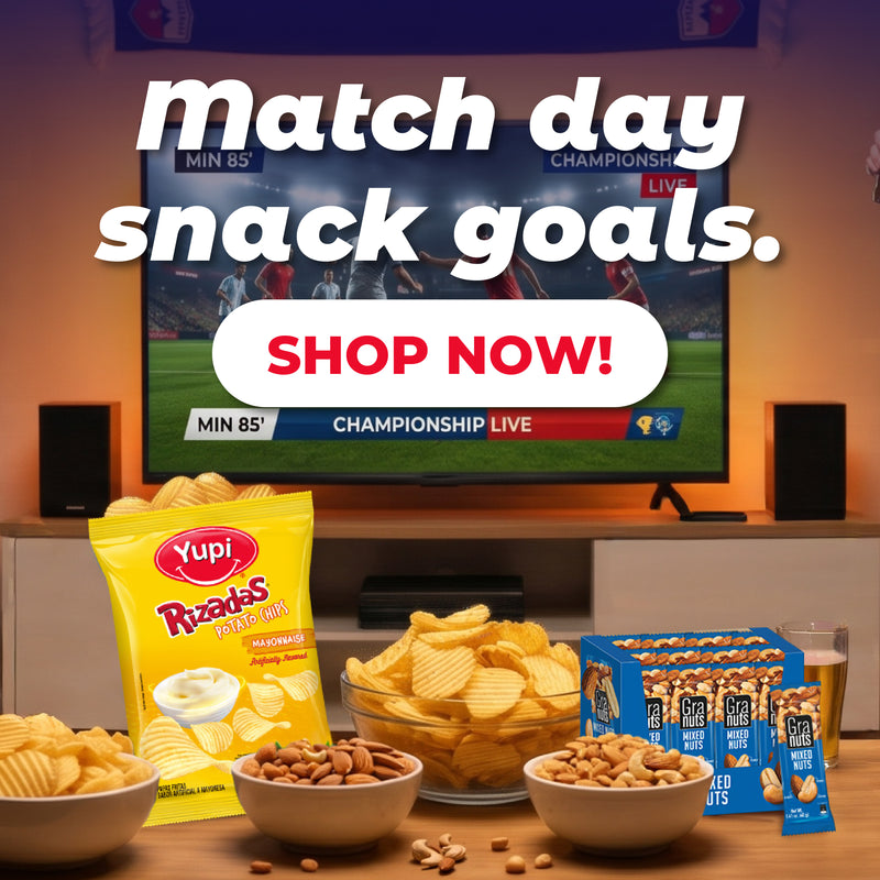 There's a package of Yupi Rizadas with Mayonnaise and a bag of Grannuts Mixed Nuts. There's also a bowl of potatoes and another bowl of Grannuts. a TV is showing a World Cup match.
In the upper right corner, the text reads:
“Match Day Snack Goals. Yupi, Grannuts, and more...”
In the lower left corner, there’s a button that says:
“Shop Now!”